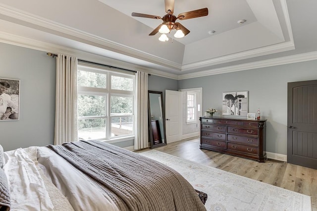 2623 Lindsey Grace Ln, Buford, GA 30519 - bedroom with a raised ceiling, light wood finished floors, baseboards, ceiling fan, and ornamental molding