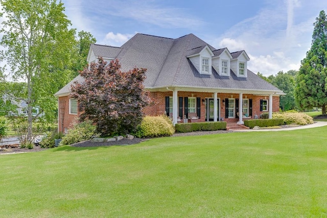 2623 Lindsey Grace Ln, Buford, GA 30519 - cape cod house with brick siding, covered porch, and a front yard