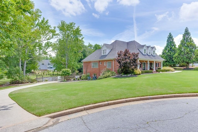 2623 Lindsey Grace Ln, Buford, GA 30519 - cape cod home with a front lawn and brick siding
