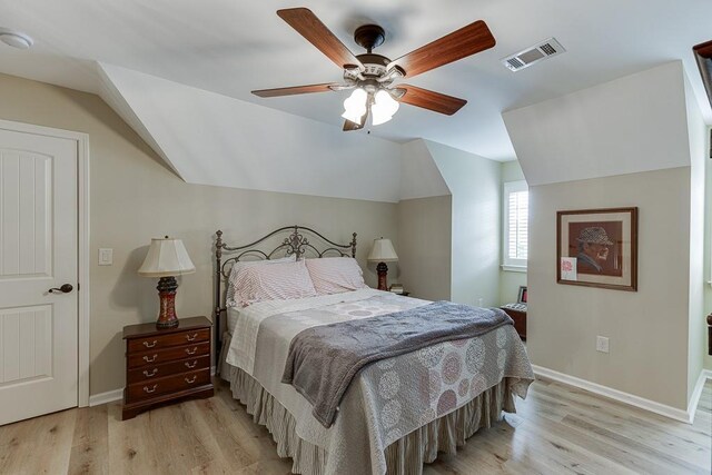 2623 Lindsey Grace Ln, Buford, GA 30519 - bedroom with light wood-style flooring, lofted ceiling, baseboards, and ceiling fan