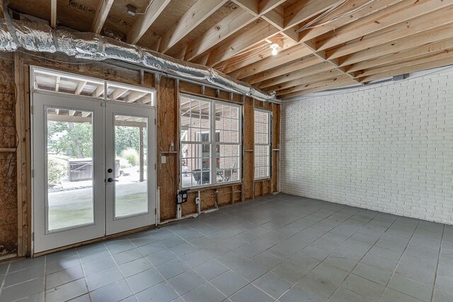 2623 Lindsey Grace Ln, Buford, GA 30519 - basement featuring french doors, tile patterned floors, and brick wall