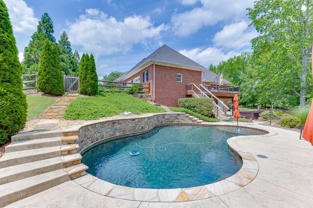 2623 Lindsey Grace Ln, Buford, GA 30519 - swimming pool with stairs, a hot tub, a wooden deck, and a patio