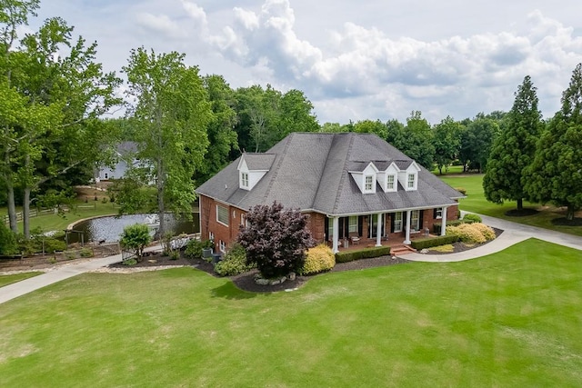 2623 Lindsey Grace Ln, Buford, GA 30519 - cape cod house featuring brick siding, a porch, and a front yard