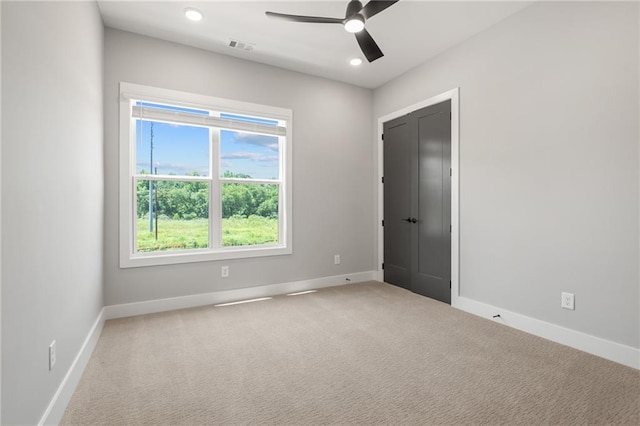 unfurnished room featuring visible vents, baseboards, a ceiling fan, carpet, and recessed lighting