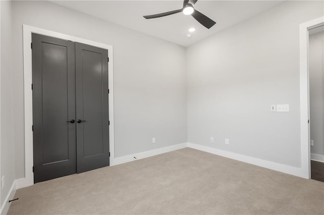 unfurnished bedroom featuring recessed lighting, a closet, carpet flooring, ceiling fan, and baseboards