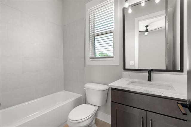 full bathroom featuring shower / bathing tub combination, vanity, toilet, and baseboards