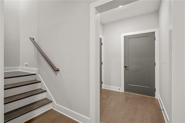 interior space with wood finished floors and baseboards