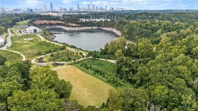 birds eye view of property featuring a water view and a view of city