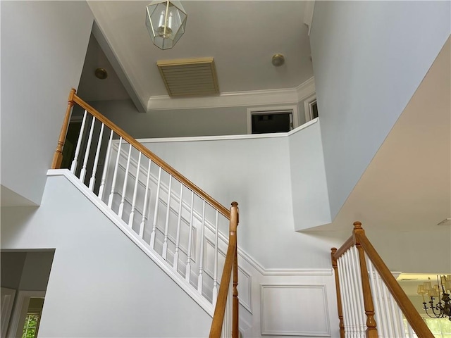 stairs featuring a high ceiling