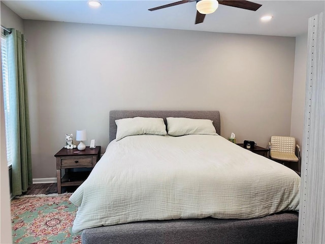 bedroom featuring wood finished floors, recessed lighting, baseboards, and a ceiling fan