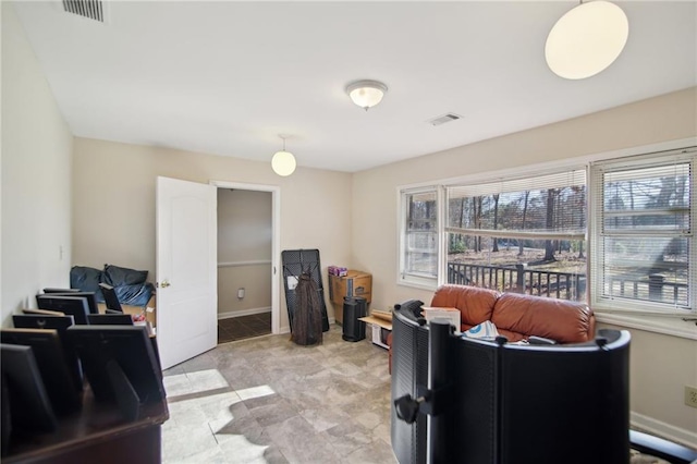 office space featuring visible vents and baseboards