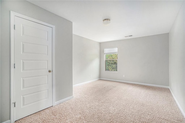 spare room featuring carpet floors