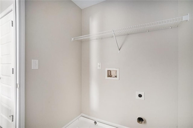 clothes washing area featuring hookup for a washing machine and electric dryer hookup