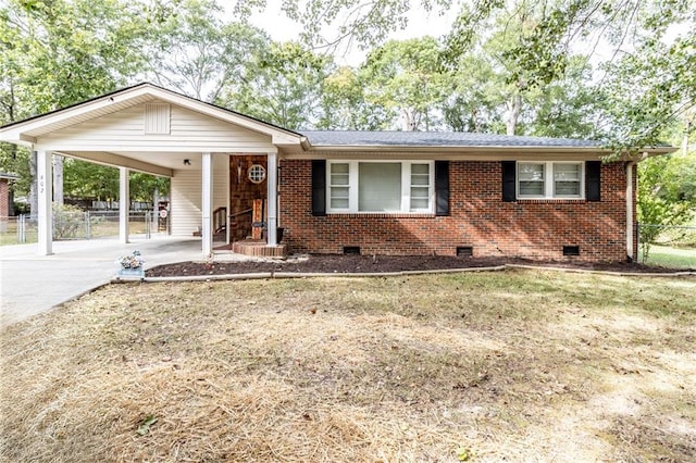 single story home with a front yard and a carport