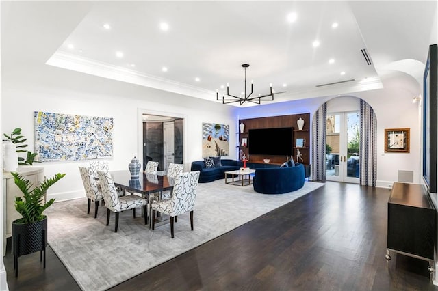 3286 Northside Pkwy NW Unit Ph2, Atlanta, GA 30327 - dining area with arched walkways, a raised ceiling, a chandelier, recessed lighting, and crown molding