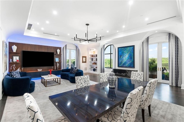 3286 Northside Pkwy NW Unit Ph2, Atlanta, GA 30327 - dining room with arched walkways, a chandelier, a raised ceiling, crown molding, and recessed lighting