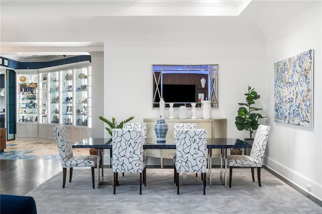 3286 Northside Pkwy NW Unit Ph2, Atlanta, GA 30327 - dining room featuring crown molding, a raised ceiling, and wood finished floors