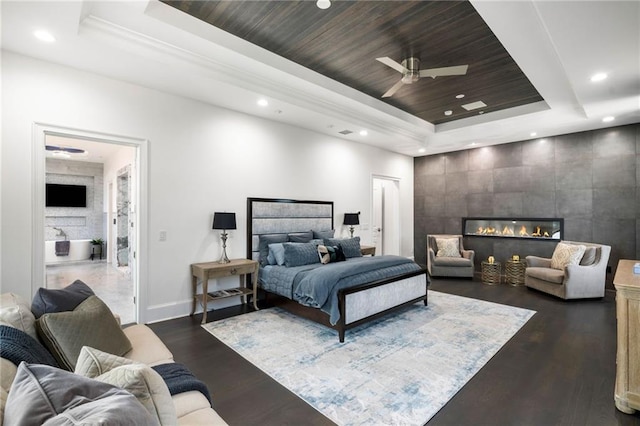 3286 Northside Pkwy NW Unit Ph2, Atlanta, GA 30327 - bedroom featuring a raised ceiling, recessed lighting, a fireplace, dark wood-type flooring, and ceiling fan