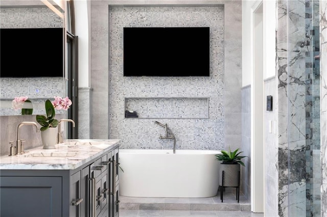 3286 Northside Pkwy NW Unit Ph2, Atlanta, GA 30327 - full bathroom with a freestanding tub, double vanity, a marble finish shower, tile walls, and tile patterned flooring