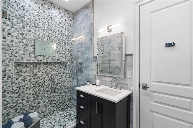 3286 Northside Pkwy NW Unit Ph2, Atlanta, GA 30327 - bathroom featuring a shower stall, tile walls, and vanity