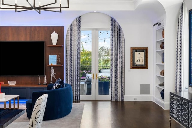 3286 Northside Pkwy NW Unit Ph2, Atlanta, GA 30327 - living area with built in shelves, wood finished floors, french doors, arched walkways, and a chandelier