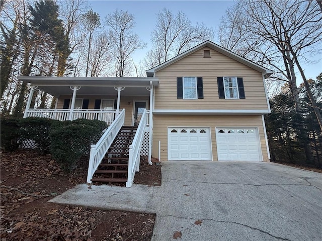 view of front facade featuring a garage and covered porch