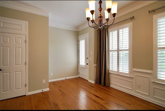 1668 Sabastian Pt NE, Atlanta, GA 30329 - unfurnished room featuring a chandelier, hardwood / wood-style floors, and ornamental molding