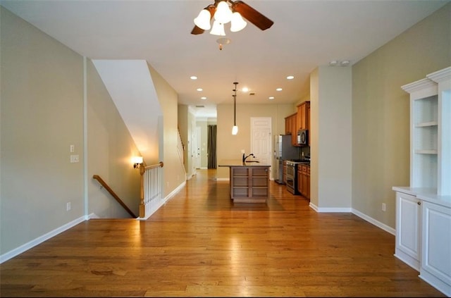 1668 Sabastian Pt NE, Atlanta, GA 30329 - living area featuring wood finished floors, a ceiling fan, and recessed lighting