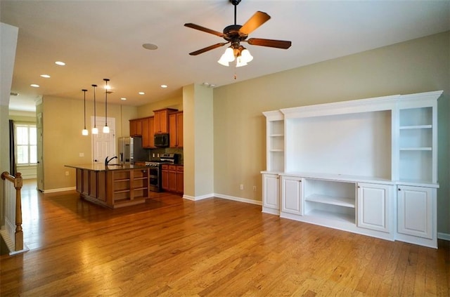 1668 Sabastian Pt NE, Atlanta, GA 30329 - unfurnished living room featuring wood finished floors, ceiling fan, and recessed lighting