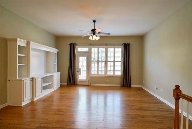 1668 Sabastian Pt NE, Atlanta, GA 30329 - unfurnished living room featuring ceiling fan and light wood finished floors