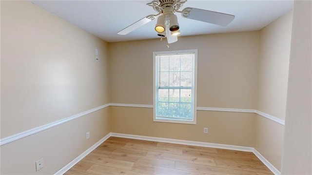 spare room with ceiling fan and light hardwood / wood-style floors