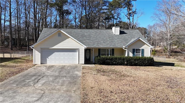 view of front facade featuring a garage and a front lawn