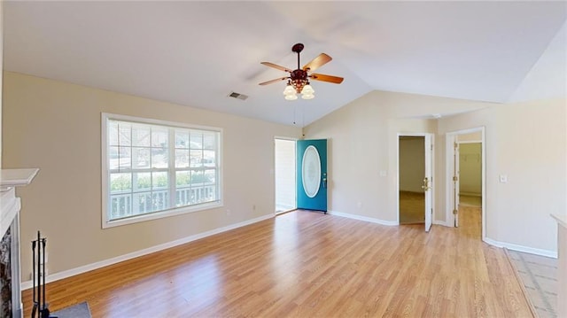 unfurnished living room with light hardwood / wood-style floors, lofted ceiling, and ceiling fan