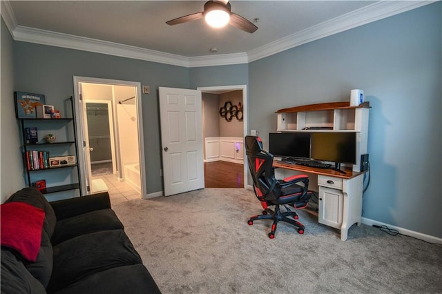 carpeted office with ceiling fan and ornamental molding