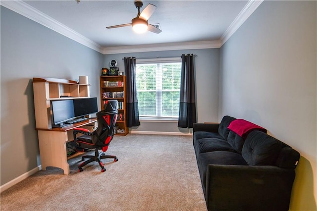 carpeted home office with ceiling fan and ornamental molding