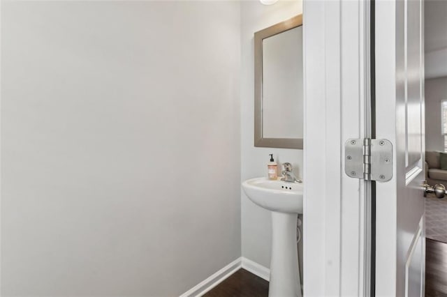 bathroom featuring hardwood / wood-style floors and sink