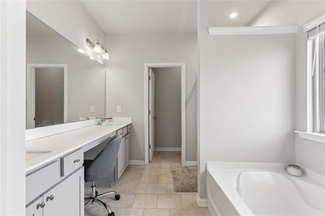 bathroom with vanity, a bath, and tile patterned flooring