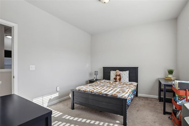 bedroom featuring light carpet