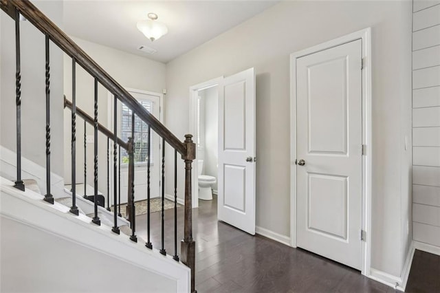 stairway featuring wood-type flooring