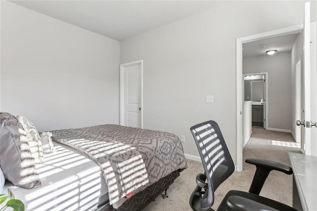 bedroom with light colored carpet