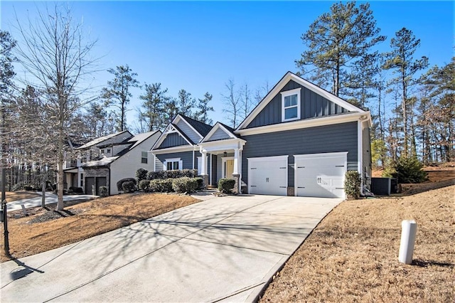 view of front of property with central AC unit and a garage