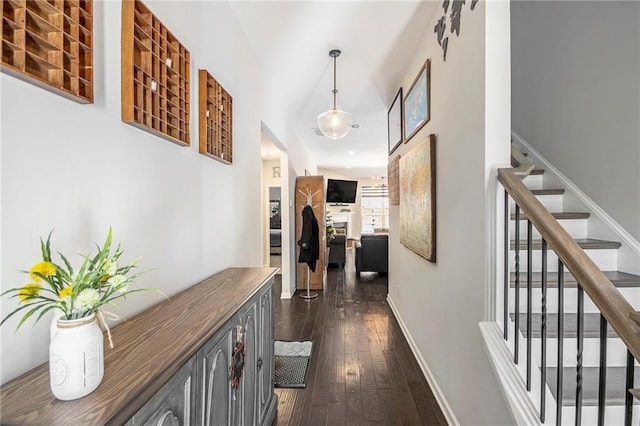 corridor with dark hardwood / wood-style floors