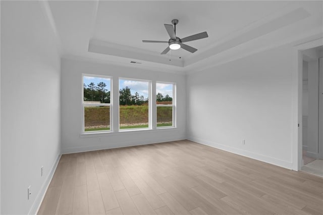 2040 Ripple Park Bnd, Canton, GA 30114 - unfurnished room with a raised ceiling, a ceiling fan, and light wood-type flooring