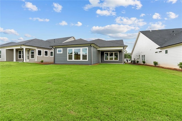 2040 Ripple Park Bnd, Canton, GA 30114 - rear view of property featuring a lawn and a shingled roof