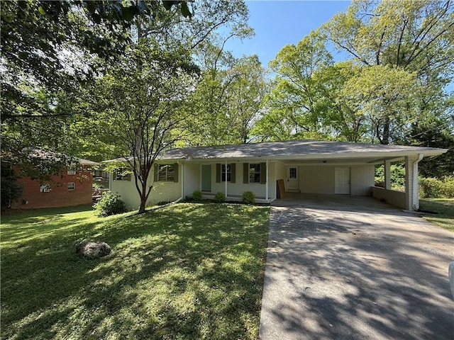 ranch-style house with concrete driveway, a carport, and a front lawn