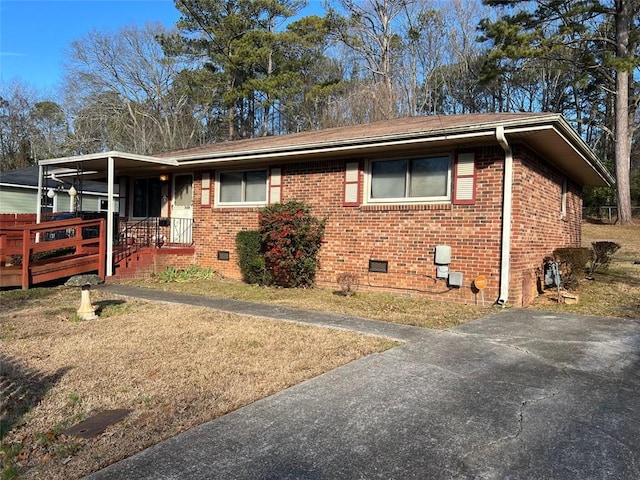 view of front facade featuring brick siding and crawl space