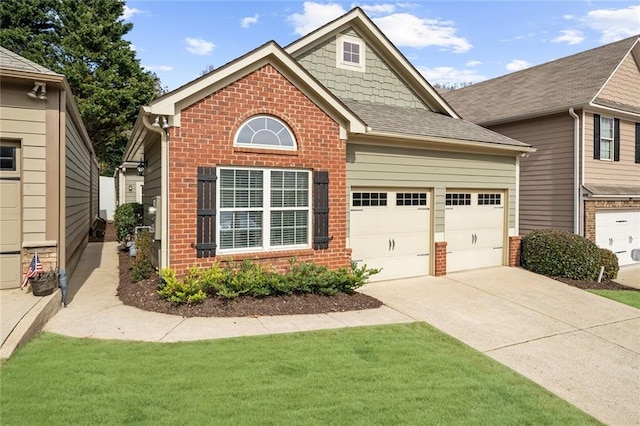 view of front of property featuring a garage and a front yard