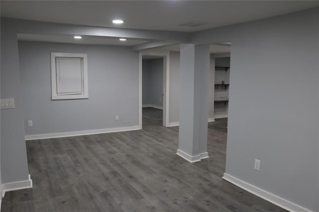 basement with dark wood-type flooring