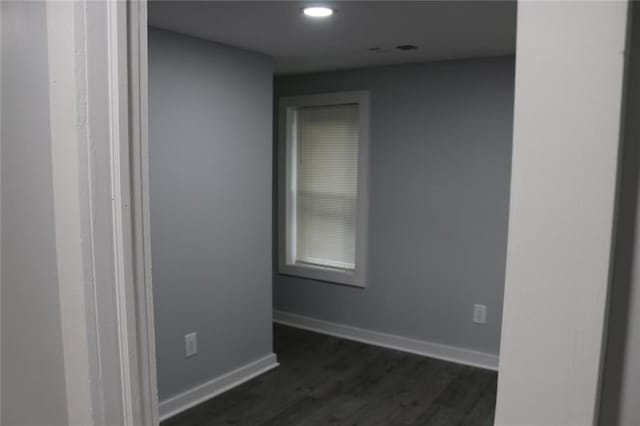 unfurnished room featuring dark hardwood / wood-style floors