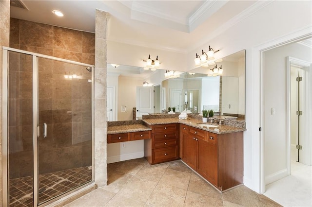 bathroom featuring crown molding, tile patterned flooring, vanity, and walk in shower